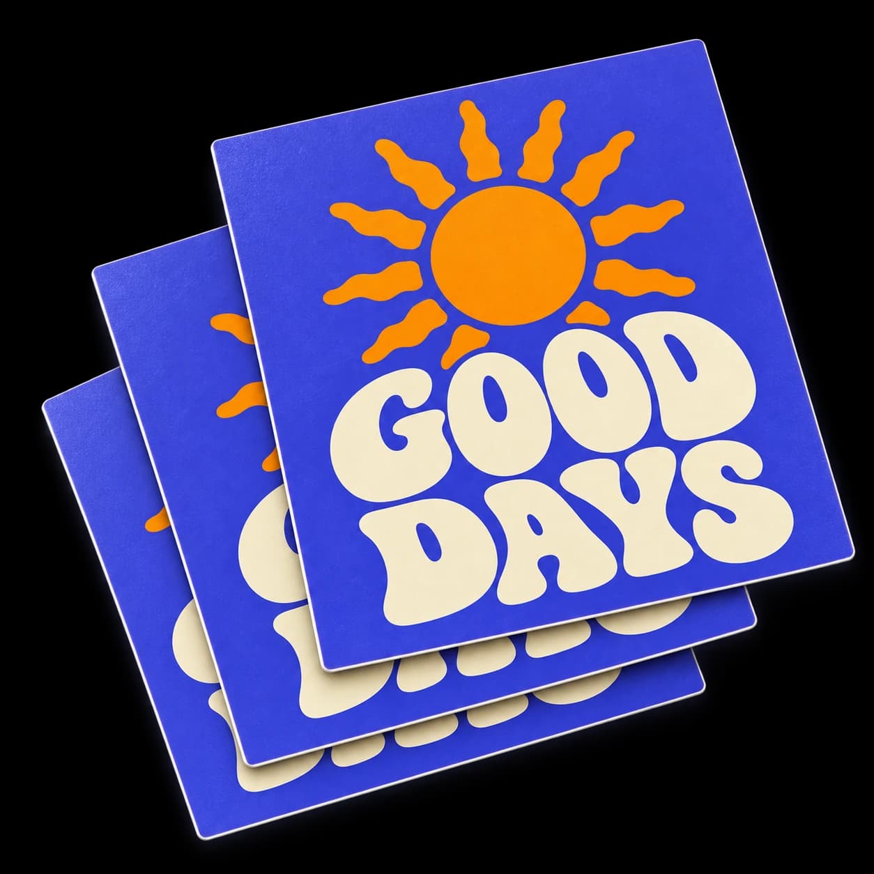 Stack of purple square Good Days stickers with an orange sun and cream lettering